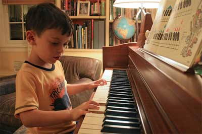 kid playing piano